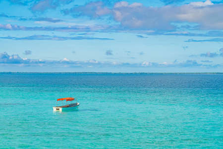 One fishing boat in water of Indian ocean. Zanzibar, Tanzania.の写真素材