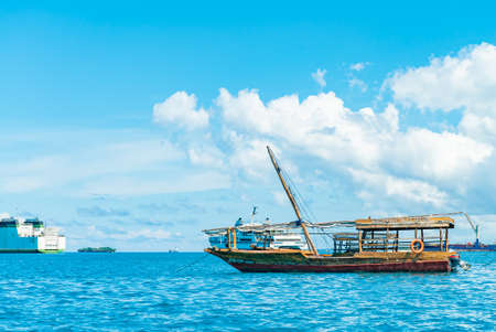 STONE TOWN, ZANZIBAR - DECEMBER 22, 2021: Boats in a port of Stone Town, Zanzibar, Tanzania.のeditorial素材