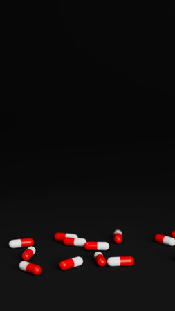 White and red pills on black background with shallow DOF. Drugs, pills, tablets, medicine concept....