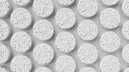 Top view on grid of glasses filled with white plastic polypropylene granules, masterbatch polymer...