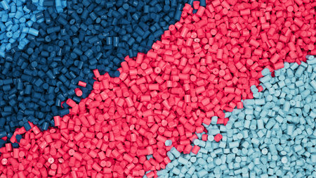 Closeup top view on piles of colorful mix plastic polypropylene granules, masterbatch polymer grain...