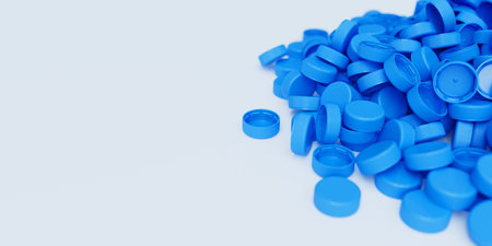 Top view on a pile of blue plastic bottle caps on white background with shallow dof. Plastic industry product. Garbage reuse. 3d render illustrationの写真素材