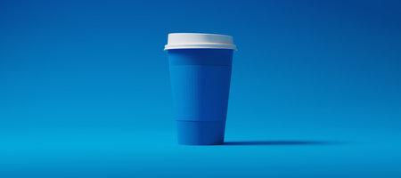 Minimalist Blue Blank Paper Coffee Cup with holder centered on a blue background. Takeaway paper...
