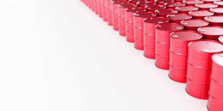 Stacked rows of red metal oil barrels on white background with place for text on left. Oil industry...