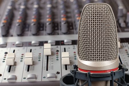 Microphone in sound studio on a background of the board