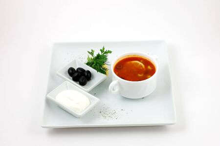 Soup from vegetables with a lemon and olivesの写真素材