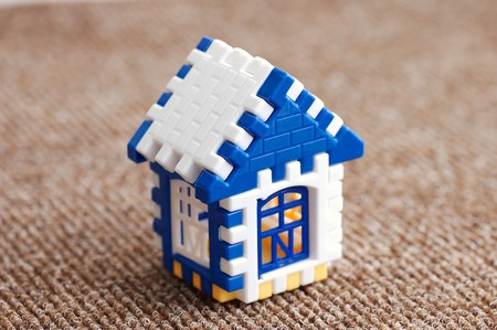 Building and designing of the house from windows of doors and a roof of bright coloursの写真素材