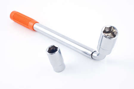Wrench of a wheel with replaceable heads on a white backgroundの写真素材