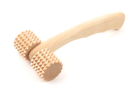 Wooden natural masseur isolated on a white background の写真素材