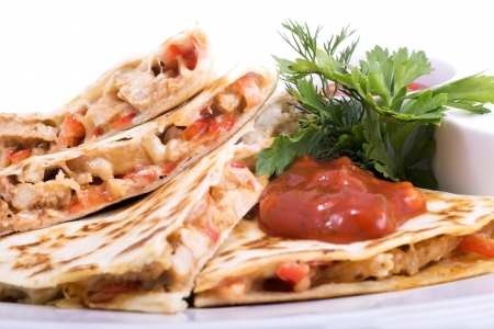 Quesadillas with Cajun Chicken Cheese Tomato Salsa and corn saladの写真素材