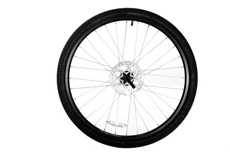 Wheel from a bicycle isolated on a white backgroundの写真素材