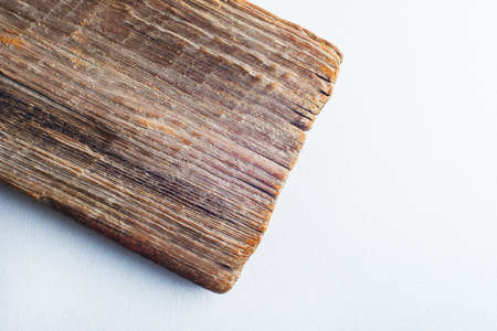 cut of an old textured board on a white backgroundの写真素材