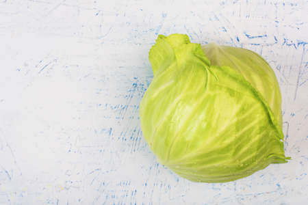 A swing of green cabbage on a white table. view from aboveの写真素材