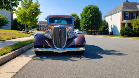 Leesburg. Virginia, USA August 14, 2021. Ford Model 40 Sedan 1934 is parked by the side of the road on a sunny day.のeditorial素材