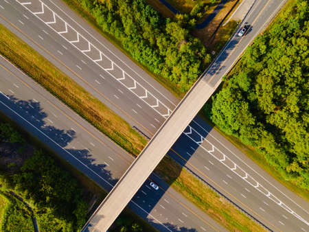 two-level intersection, road junction. Summer landscape. Drone view