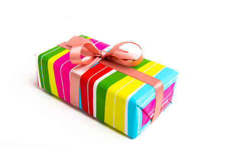 Striped gift box with pink ribbon on a white background. Birthday, Valentine's Day, Christmas, Wedding, Anniversary, March 8, Women's Day, Mother's Day.の写真素材