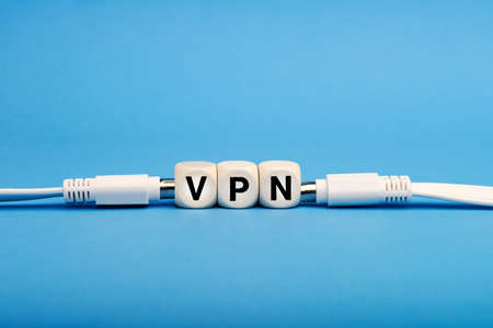 vpn written on a wooden cubes. Secure and private Internet access. Blocked sites.の写真素材