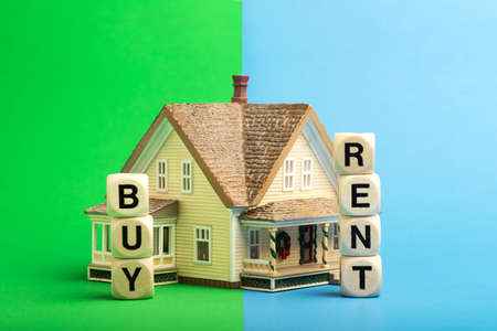Buy or rent a house Concept from wooden cubes.の写真素材