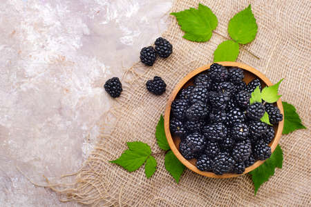 fresh blackberries in a wooden plate. View from above.Copy space.の写真素材