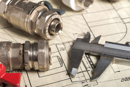 Various details for connecting water pipes on the drawing. Measuring tool close-up.の写真素材