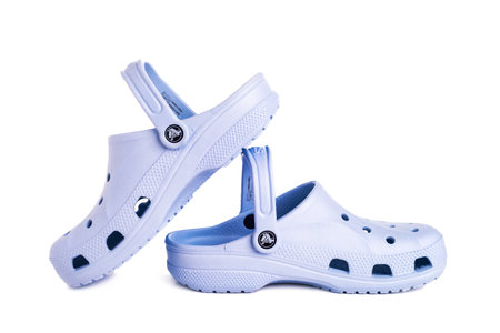 Leesburg. Virginia. USA. 09/21/2022. blue Crocs footwear, foam clog shoes on a white background.のeditorial素材