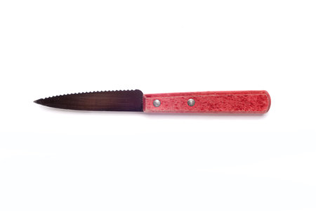 old kitchen knife with red.wooden handle isolated on white background.