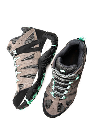 Pair of hiking boots, isolated on a white background.