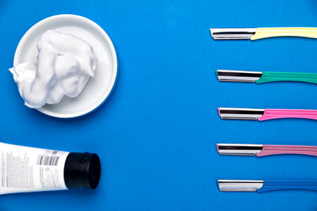 Colored razor shavers, on a blue background. image of beautiful multicolored razor shavers and...