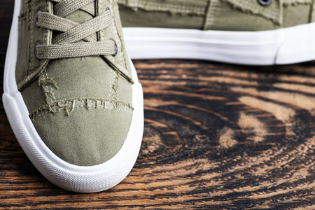 Fashionable hipster shoes on a dark wooden background.Close-up, space for text.の写真素材
