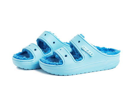pair of blue Crocs sandals with a padded insole on a white background.