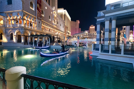 gondoliers, canal with gondolas and italian architecture. Venetian-style hotel and casino on the Las Vegas Strip in Vegas, Nevada.のeditorial素材