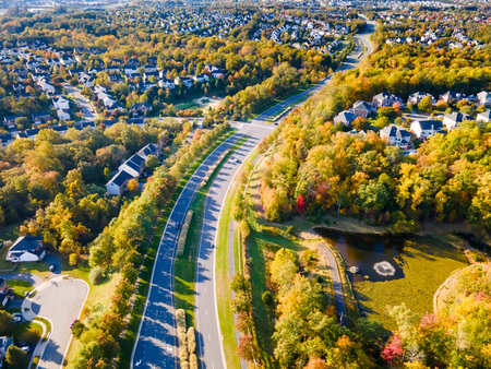 View of a small town with low-rise houses in Virginia USA. Drone view of the autumn landscape with a road.の写真素材