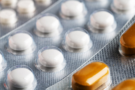 tablets and capsules pill in blister packaging arranged close-up.の写真素材