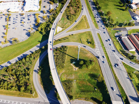 Aerial drone view of elevated road and traffic junctions. Large parking and transport highway....