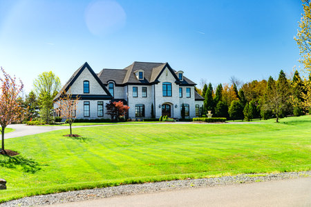 Big House suburb Single Family . Brick house with nice landscape and large green lawn.のeditorial素材