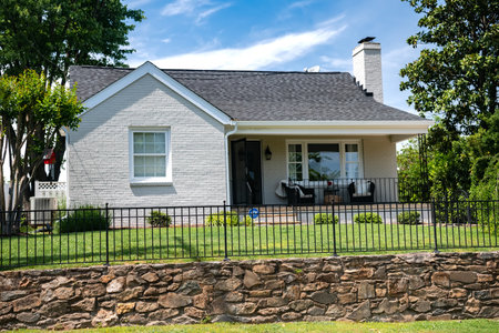 Residential one-story house for one family. Traditional American style home with beautiful landscaping.のeditorial素材