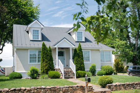 Residential house for one family. Traditional American style home with beautiful landscaping.のeditorial素材