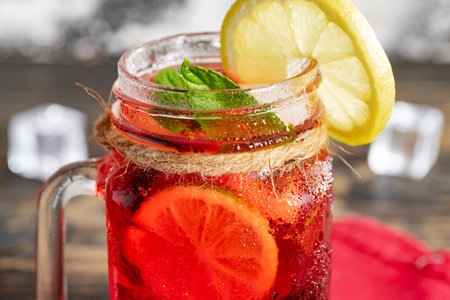 cherry soft drink with mint, lime and lemon. close-up.の写真素材