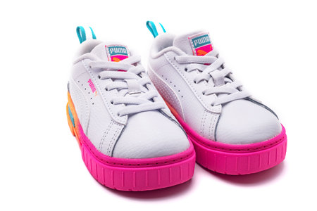 Children's sneakers Puma on a white background. Bright sports walking shoes for girls.のeditorial素材