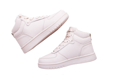 classic sneakers or trainers on white background. fashionable sports shoes. Creative minimalistic layout with footwear mock up for your design.の写真素材