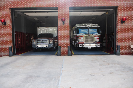 Berlin Fire Company. Fire station in a small town Berlin in Maryland USA. Two fire trucks are in the open garage.のeditorial素材