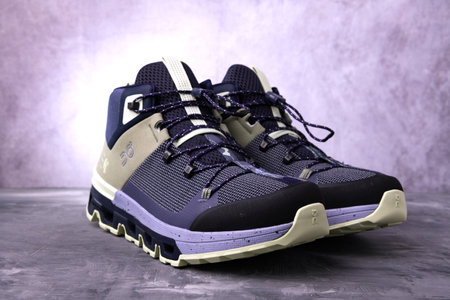 QC sports sneakers on a gray background close-up. studio shot.のeditorial素材