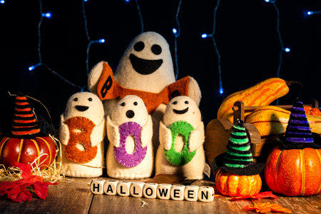 Boo, Halloween ghost toys are spooky and pumpkins on dark background.の写真素材