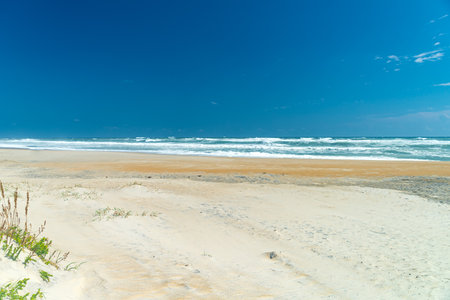 Deserted shore, waves and sky of the Atlantic Oceanの写真素材