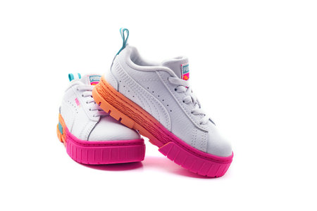Children's Puma sneakers on a white background. Sports concept. Close-up.のeditorial素材