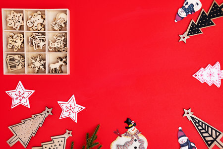 Christmas, winter, new year concept. Flat lay, top view, copy space. Christmas composition. Christmas toys on a red background. background.の写真素材