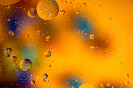 Colorful artistic of oil drop floating on the water. Abstract colors water bubbles background....