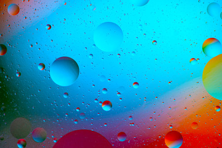 movement of oil bubbles in the liquid. Fantastic structure of colorful bubbles. Colorful artistic...