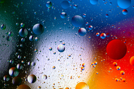 Colorful artistic of oil drop floating on the water. Abstract colors water bubbles background....