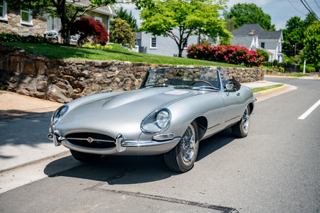 collectible Convertible Jaguar E Type parked on the side of the road.のeditorial素材